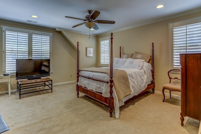 bedroom with ceiling fan, light colored carpet, and ornamental molding