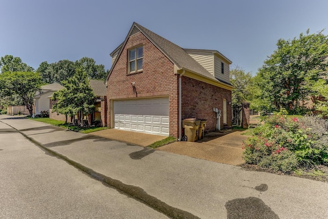 view of side of property with a garage