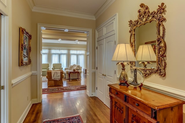 interior space featuring hardwood / wood-style floors and crown molding