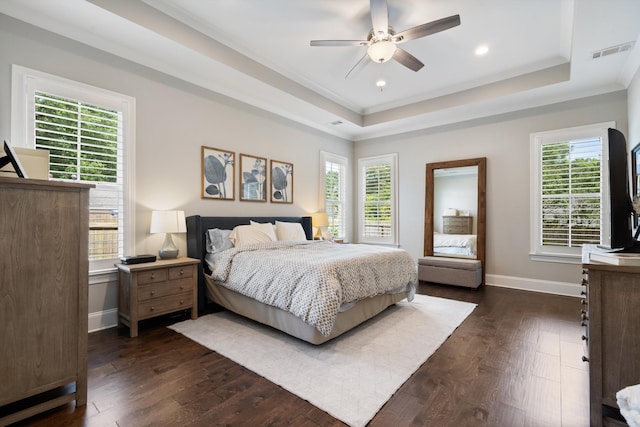 bedroom featuring multiple windows, ceiling fan, and dark hardwood / wood-style flooring