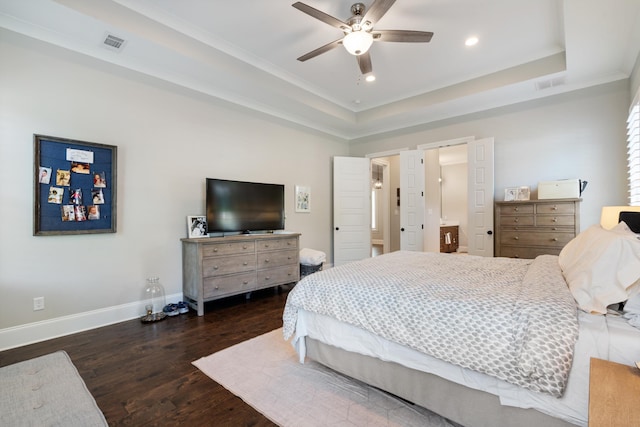 bedroom with a raised ceiling, ceiling fan, dark hardwood / wood-style flooring, and crown molding