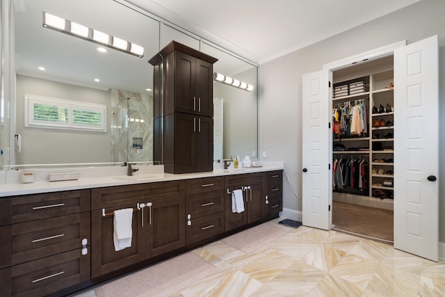 bathroom featuring vanity and an enclosed shower