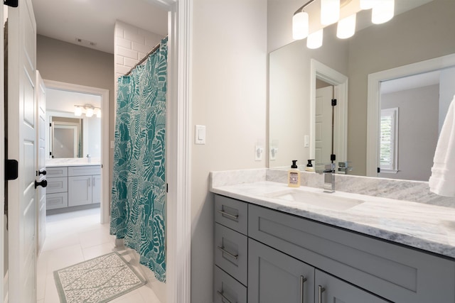 bathroom featuring tile patterned floors and vanity