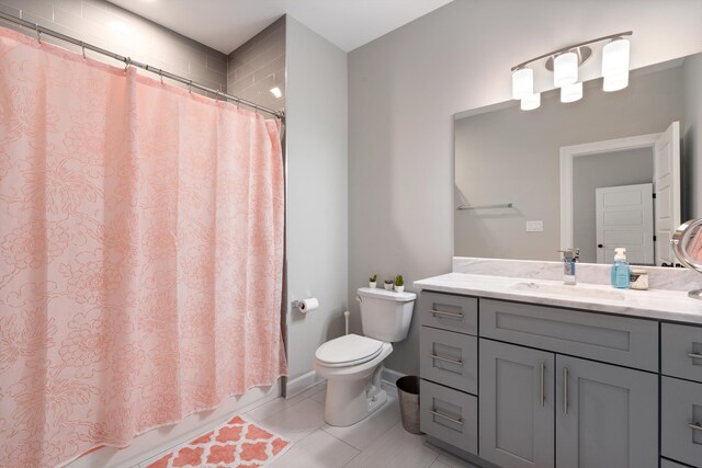 full bathroom with tile patterned flooring, vanity, toilet, and shower / tub combo with curtain