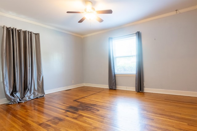 unfurnished room with hardwood / wood-style flooring, ceiling fan, and ornamental molding