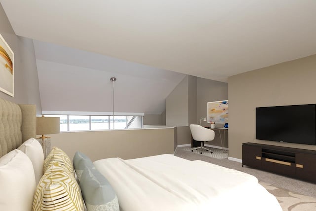 carpeted bedroom featuring vaulted ceiling