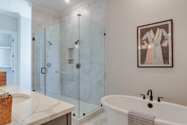 bathroom with plus walk in shower, vanity, and crown molding