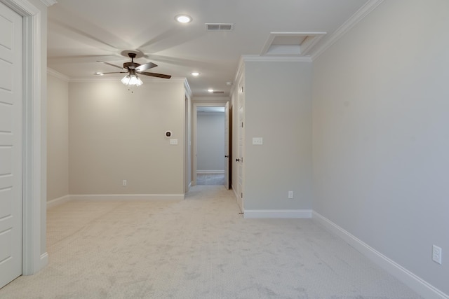 carpeted empty room featuring crown molding and ceiling fan