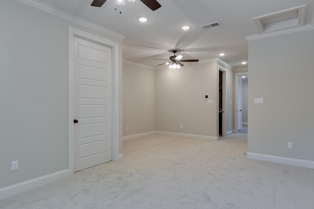 carpeted spare room featuring crown molding and ceiling fan