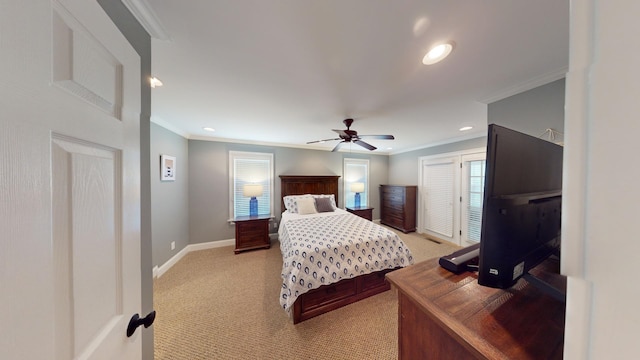 carpeted bedroom with ceiling fan and crown molding