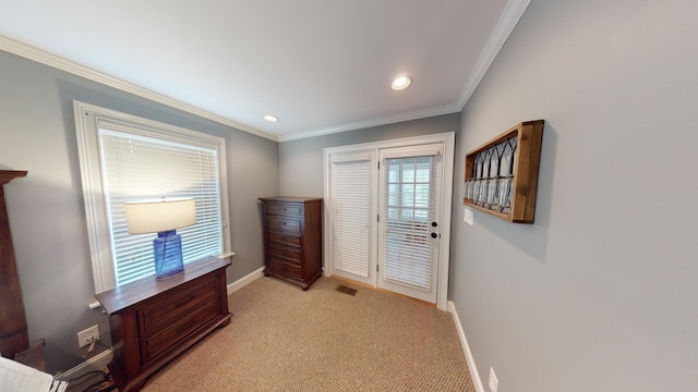 interior space featuring crown molding and light colored carpet