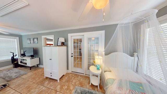 interior space featuring ceiling fan, a healthy amount of sunlight, and crown molding