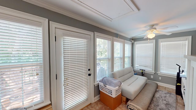 sunroom with a healthy amount of sunlight and ceiling fan