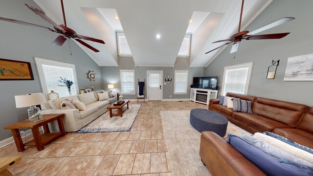 living room with a high ceiling and ceiling fan