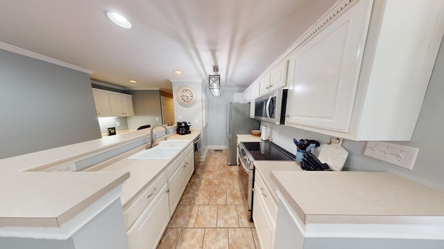 kitchen with stainless steel appliances, pendant lighting, light tile floors, sink, and white cabinetry