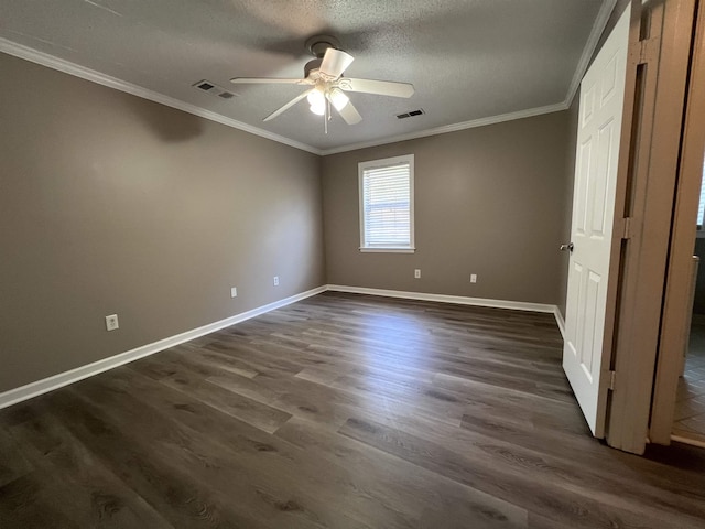 unfurnished bedroom with ceiling fan, dark hardwood / wood-style floors, ornamental molding, and a textured ceiling