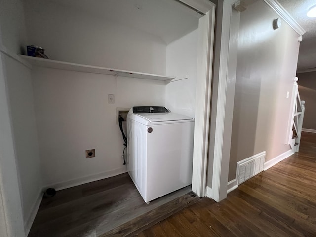 washroom with washer / dryer and dark wood-type flooring