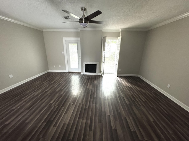 unfurnished living room featuring crown molding, ceiling fan, dark hardwood / wood-style floors, and a textured ceiling