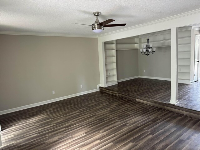 unfurnished living room featuring dark hardwood / wood-style flooring, ornamental molding, ceiling fan with notable chandelier, a textured ceiling, and built in features