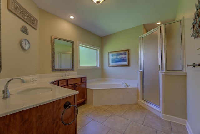 bathroom featuring tile patterned floors, vanity, and separate shower and tub