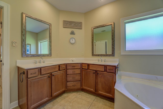 bathroom with vanity, tile patterned flooring, and a bathing tub