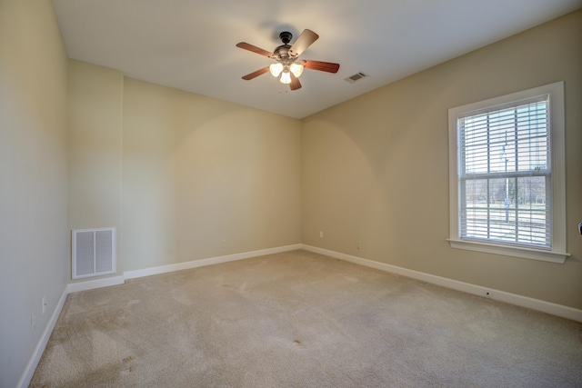 carpeted empty room with ceiling fan