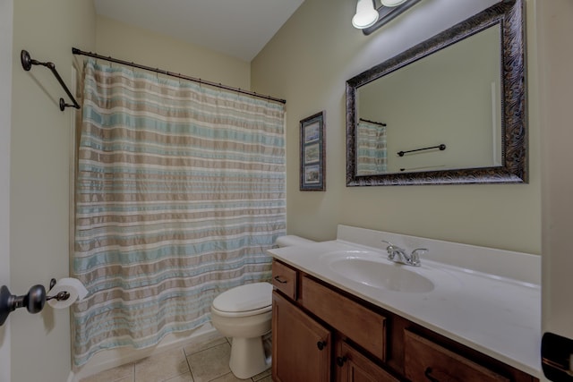 full bathroom with shower / bath combo, tile patterned floors, vanity, and toilet