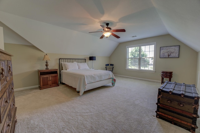 bedroom featuring ceiling fan, lofted ceiling, and light colored carpet