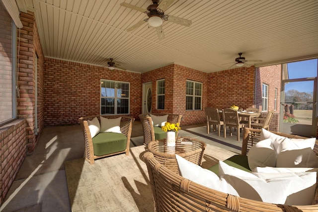 view of patio / terrace with ceiling fan and an outdoor living space