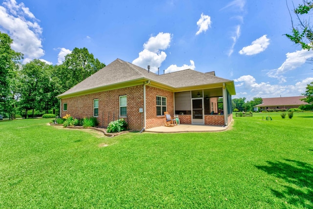 rear view of property with a patio area and a lawn