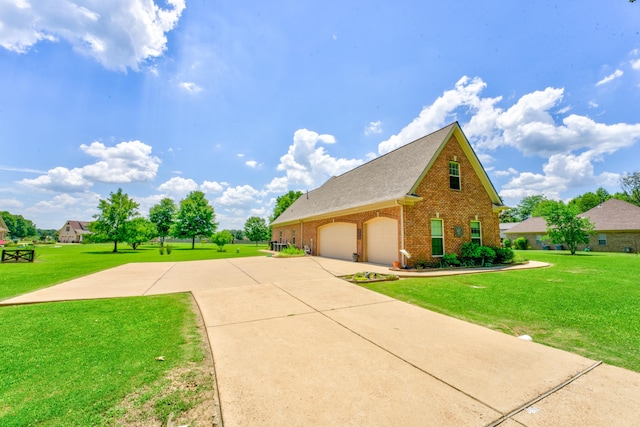 view of property exterior with a garage and a lawn