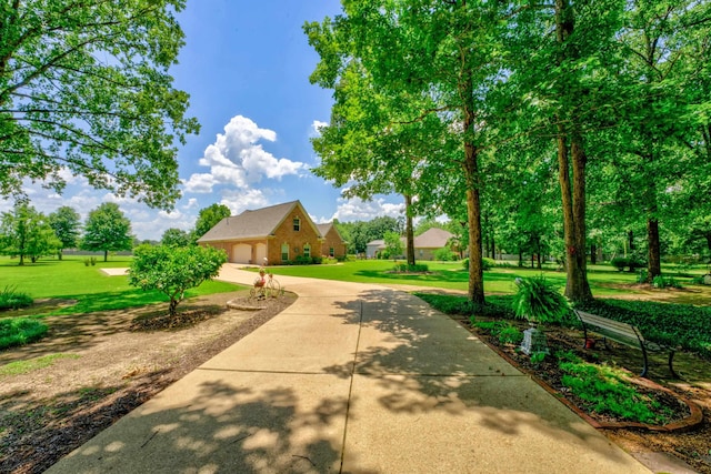 surrounding community with a yard and a garage