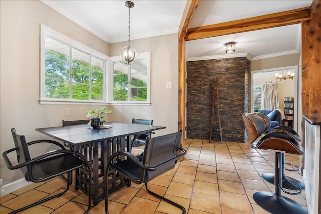 tiled dining area featuring a notable chandelier and crown molding