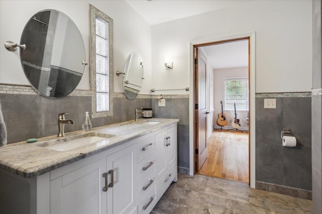 bathroom with tile flooring and double vanity