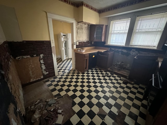 kitchen featuring dark tile floors