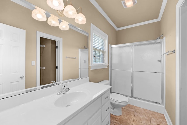 bathroom with crown molding, tile patterned flooring, vanity, toilet, and walk in shower