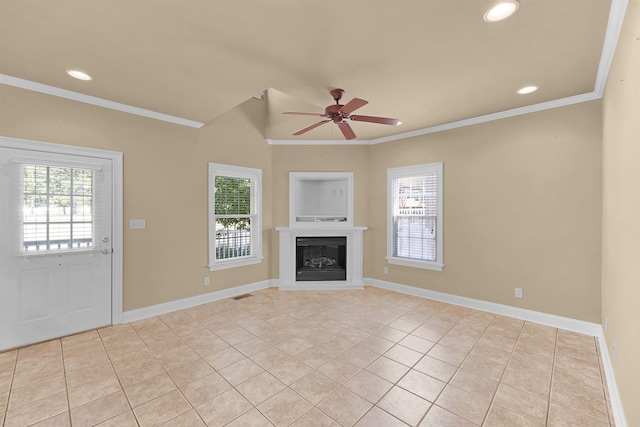 unfurnished living room with ornamental molding and a healthy amount of sunlight