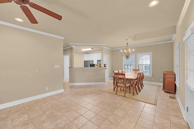 tiled dining area featuring ornamental molding and ceiling fan with notable chandelier