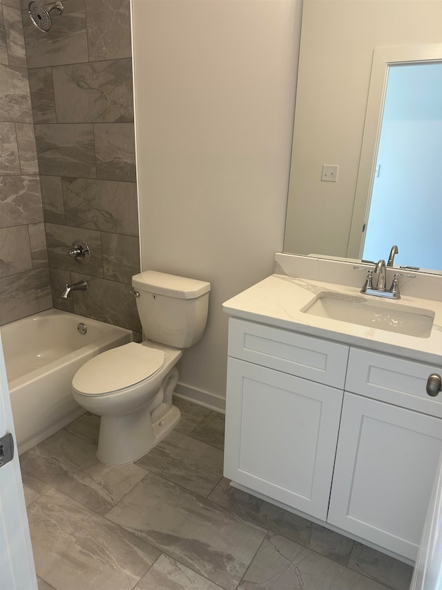 full bathroom with marble finish floor, bathing tub / shower combination, toilet, vanity, and baseboards