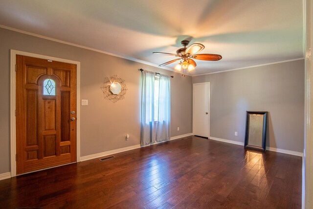 foyer with ceiling fan, dark hardwood / wood-style flooring, and ornamental molding