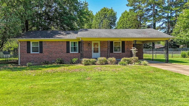 ranch-style house with a carport and a front lawn