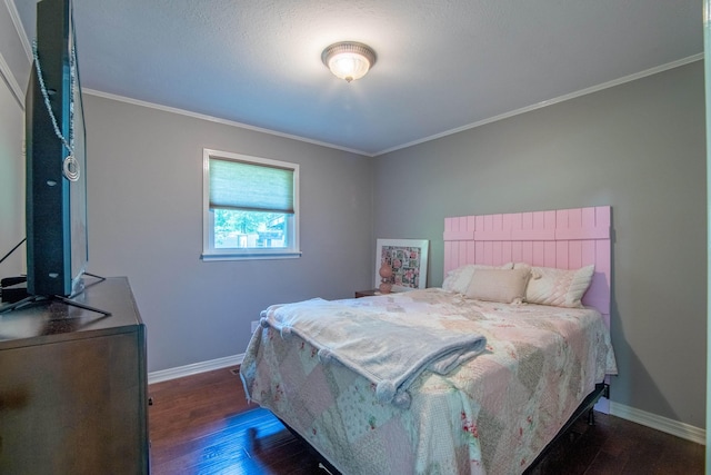 bedroom featuring dark hardwood / wood-style floors and crown molding