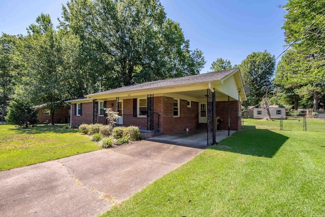 single story home with a carport, covered porch, and a front yard