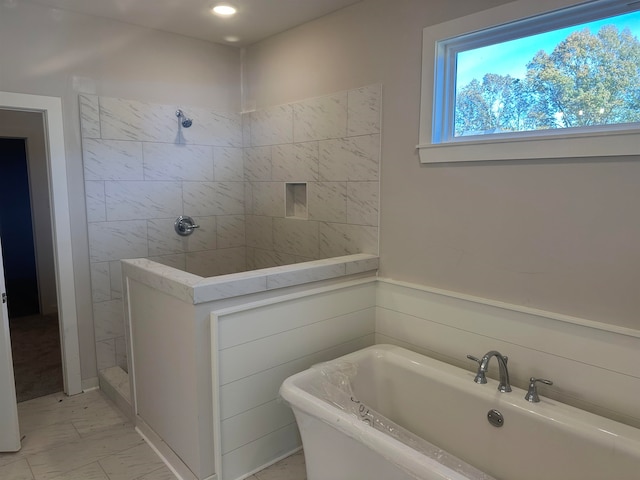 bathroom with shower with separate bathtub