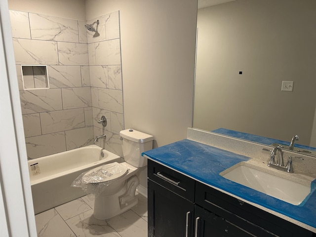 full bathroom with vanity, toilet, and tiled shower / bath combo