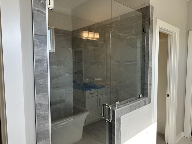 bathroom featuring tile patterned flooring, an enclosed shower, and toilet