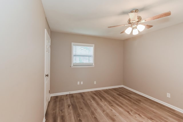 unfurnished room with light wood-style floors, baseboards, and ceiling fan