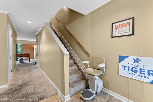 stairs with carpet flooring and crown molding