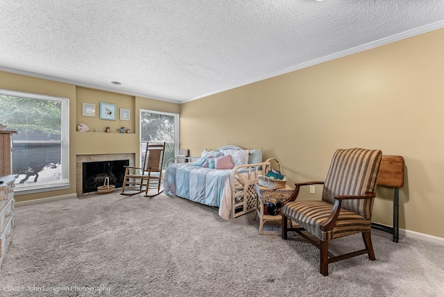 carpeted bedroom with crown molding and a textured ceiling