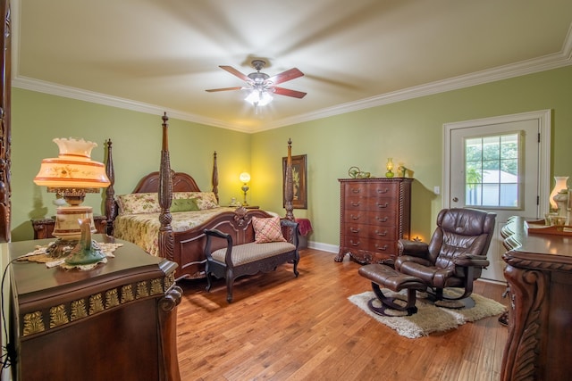 bedroom featuring ceiling fan, light hardwood / wood-style floors, and ornamental molding